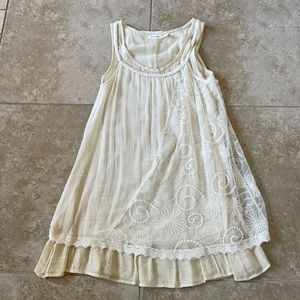 Blu Pepper cream gauze dress with lace overlay.